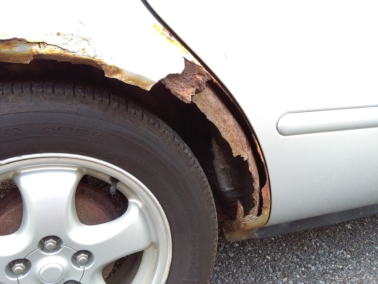 The fender of this car has rusted through