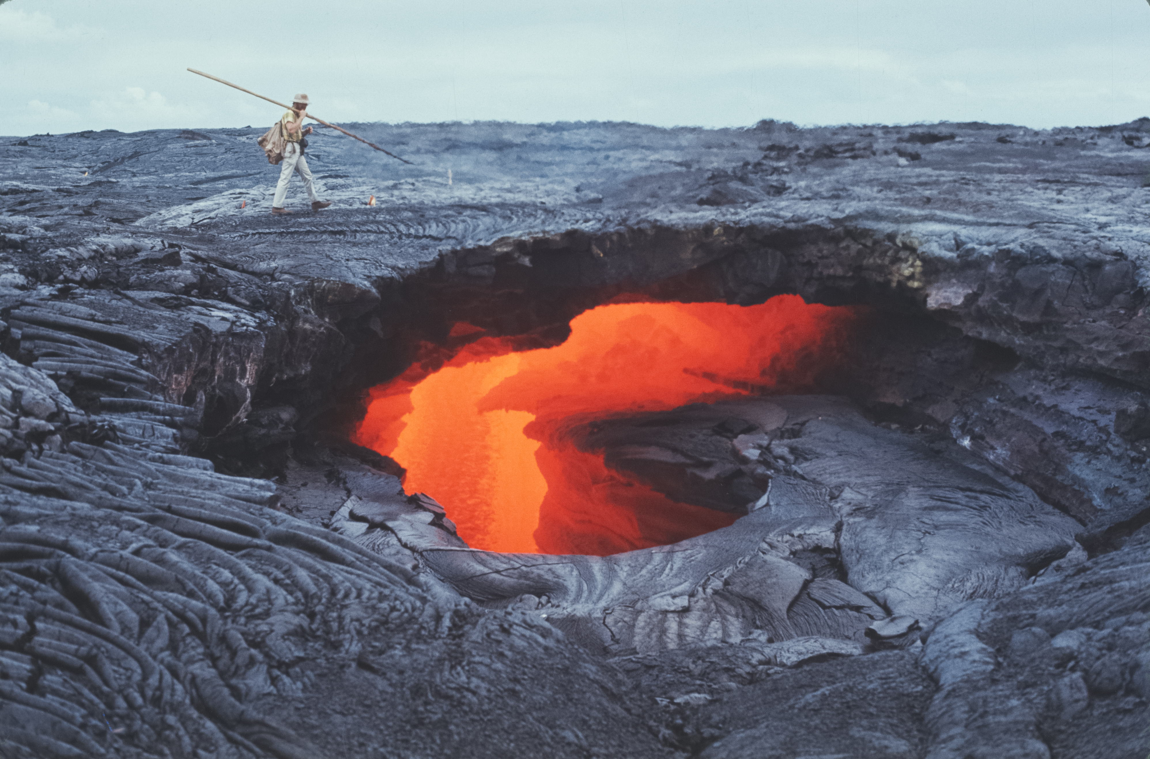 A peek through a "skylight" into the interior of an active lava tube on the south flank of the Kīlauea Volcano on Hawai‘i’s big island in the early 1970s.