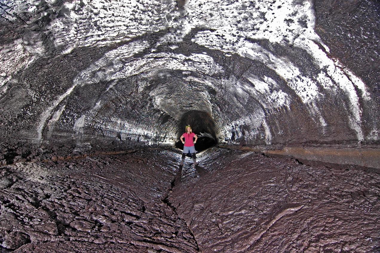 In this image, the floor of the lava tube, formed as a crust on a lava lake, collapsed downward after an ancient lava lake emptied.