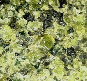 Peridotites are coarse-grained ultramafic mantle rocks mostly made up of green olivine and black pyroxene.