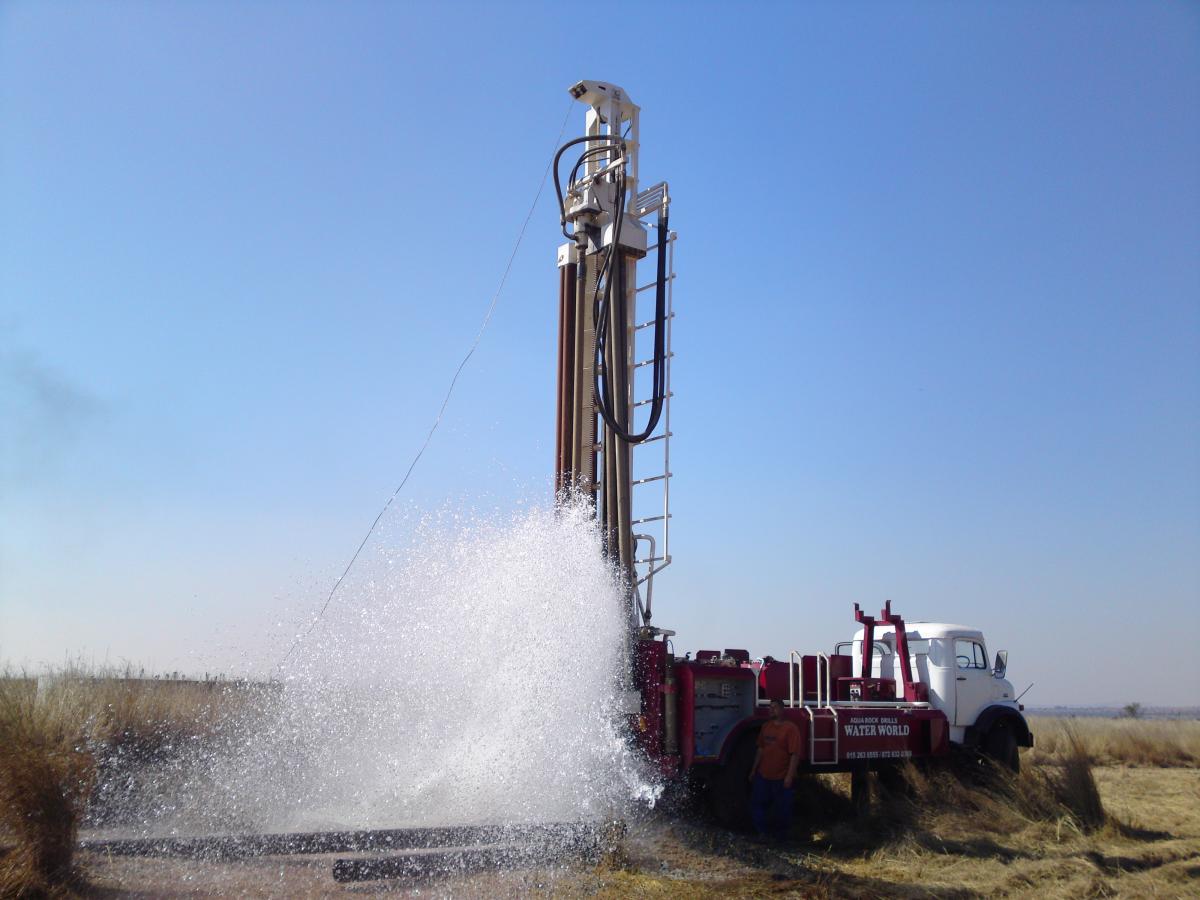 Water flowing from a newly drilled well.