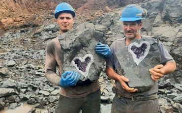 Miners split open a once-in-a-lifetime geode containing amethyst crystals in the shape of a heart.