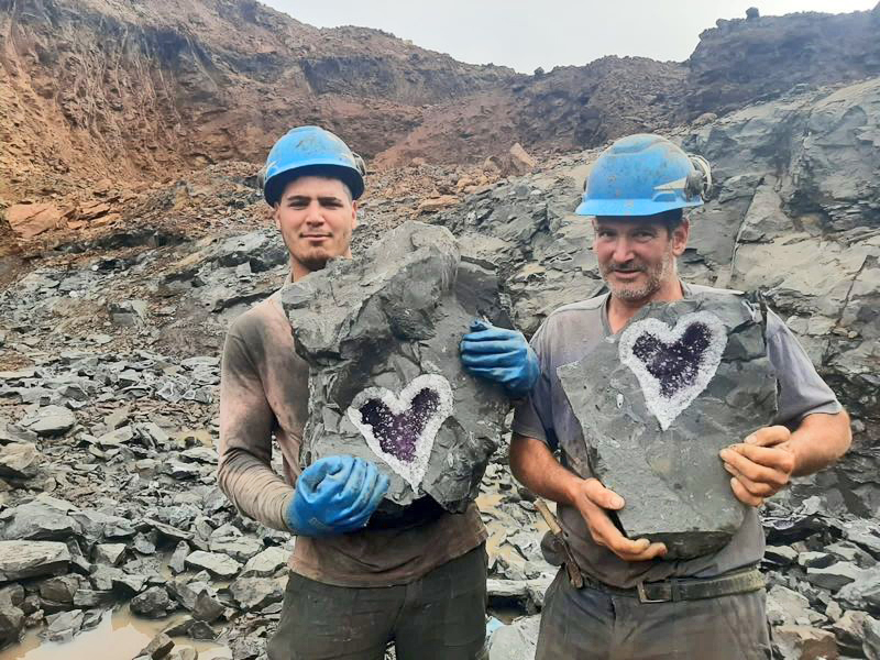 Miners split open a once-in-a-lifetime geode containing amethyst crystals in the shape of a heart.