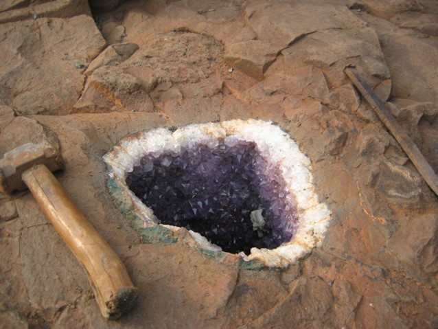 An amethyst geode within its volcanic parent rock.